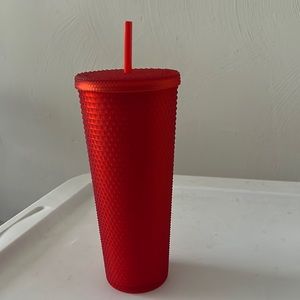 Red studded Starbucks tumbler